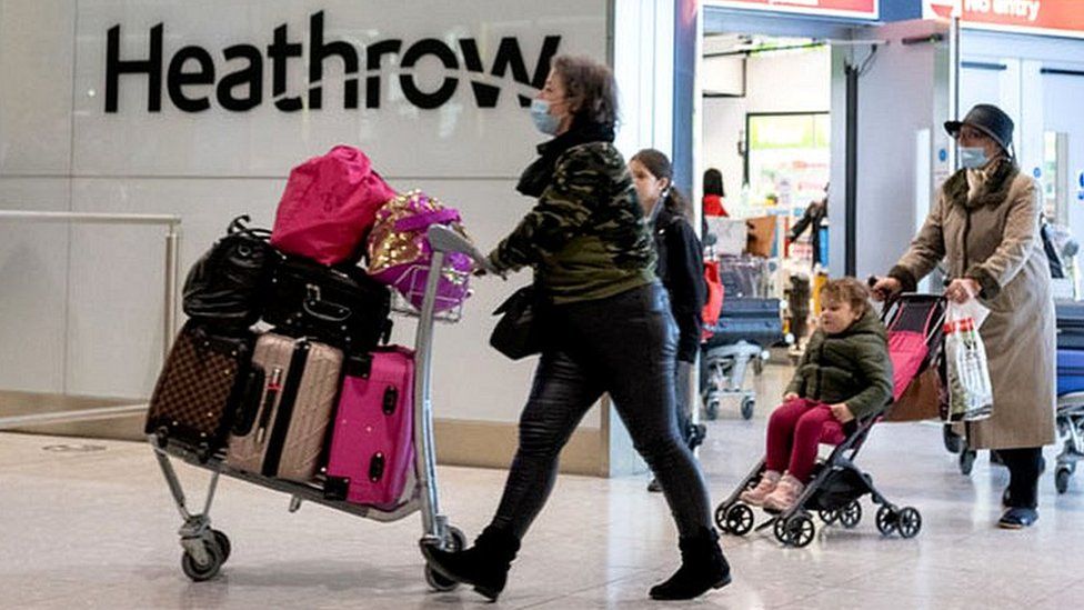 Passengers arrive at Heathrow Airport just in time for Christmas in a few days on December 22, 2020 in London, England.