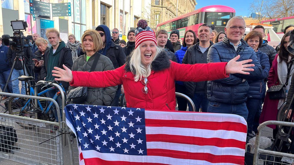 Woman waits for Joe Biden