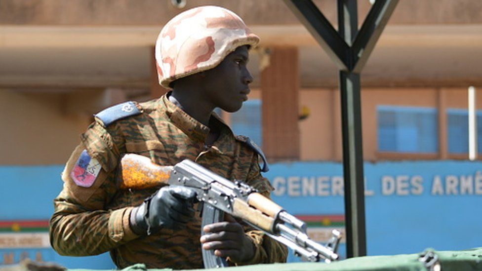 A soldier stand guard outside the headquarters of the country's defence forces in the capital Ouagadougou