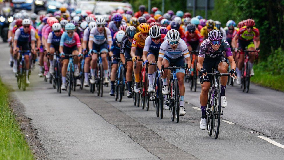 The peloton rides through Corse, Gloucestershire