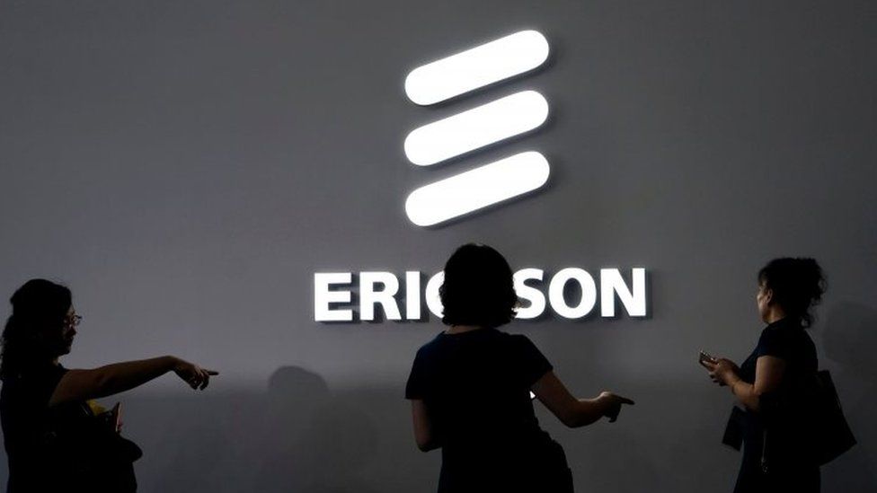 People look at Ericsson's logo. File photo