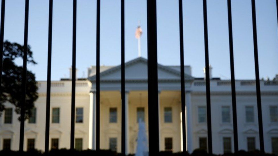 The White House seen done  gates outside.