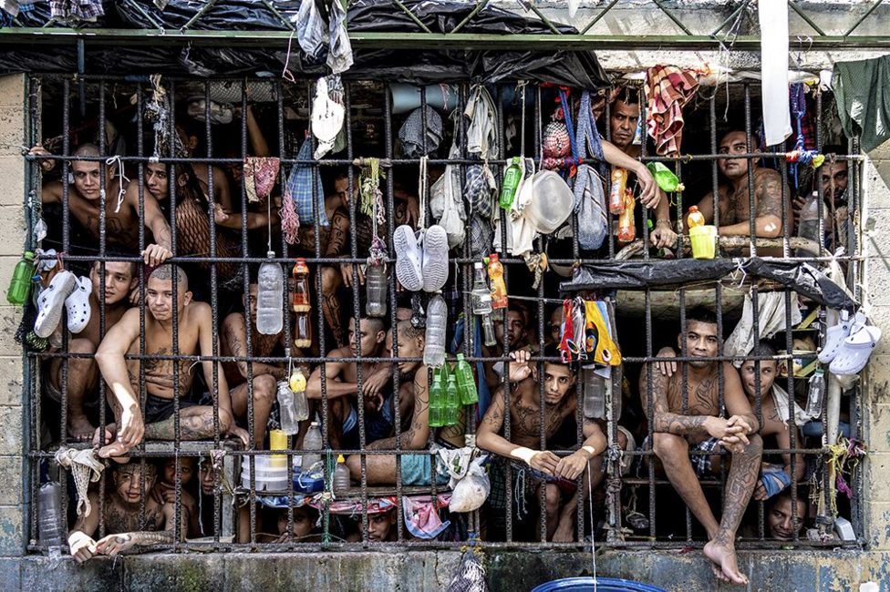 Inmates look out of an overcrowded cell in the Penal Center of Quezaltepeque, El Salvador. 9 November, 2018