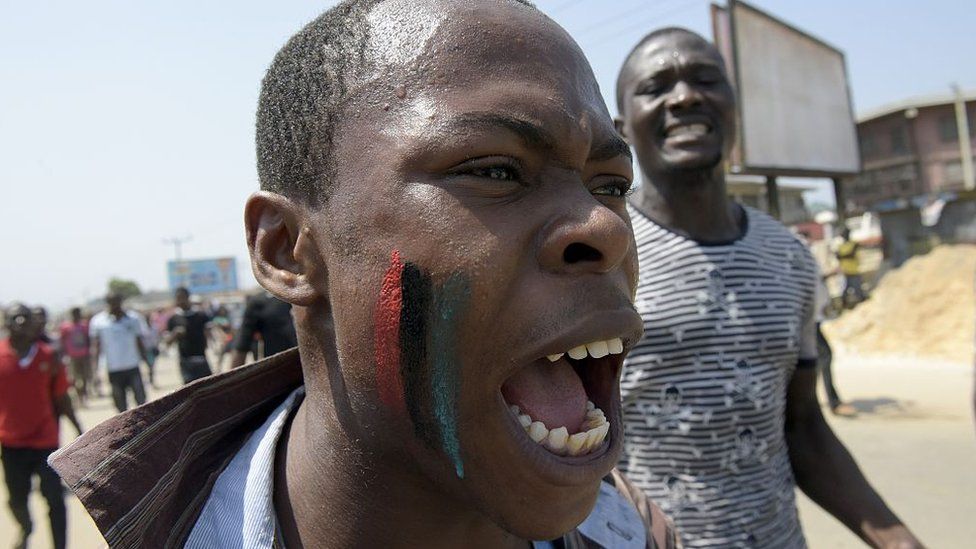 A pro-Biafra supporter chants a song in Aba, southeastern Nigeria, during a protest calling for the release of a key activist on November 18, 2015.