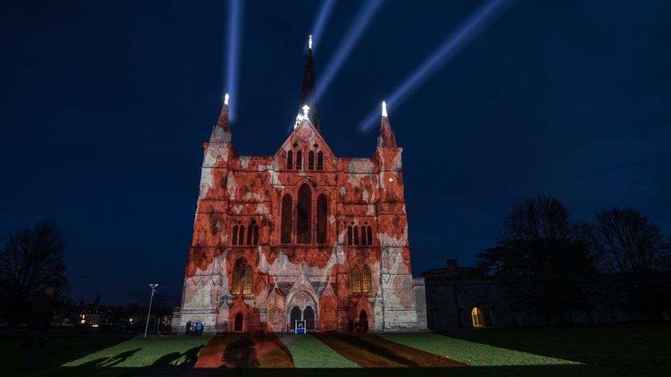 The Royal British Legion"s falling poppy display is projected onto the West Front of Salisbury Cathedral to commemorate the 100th anniversary of the armistice in Salisbury
