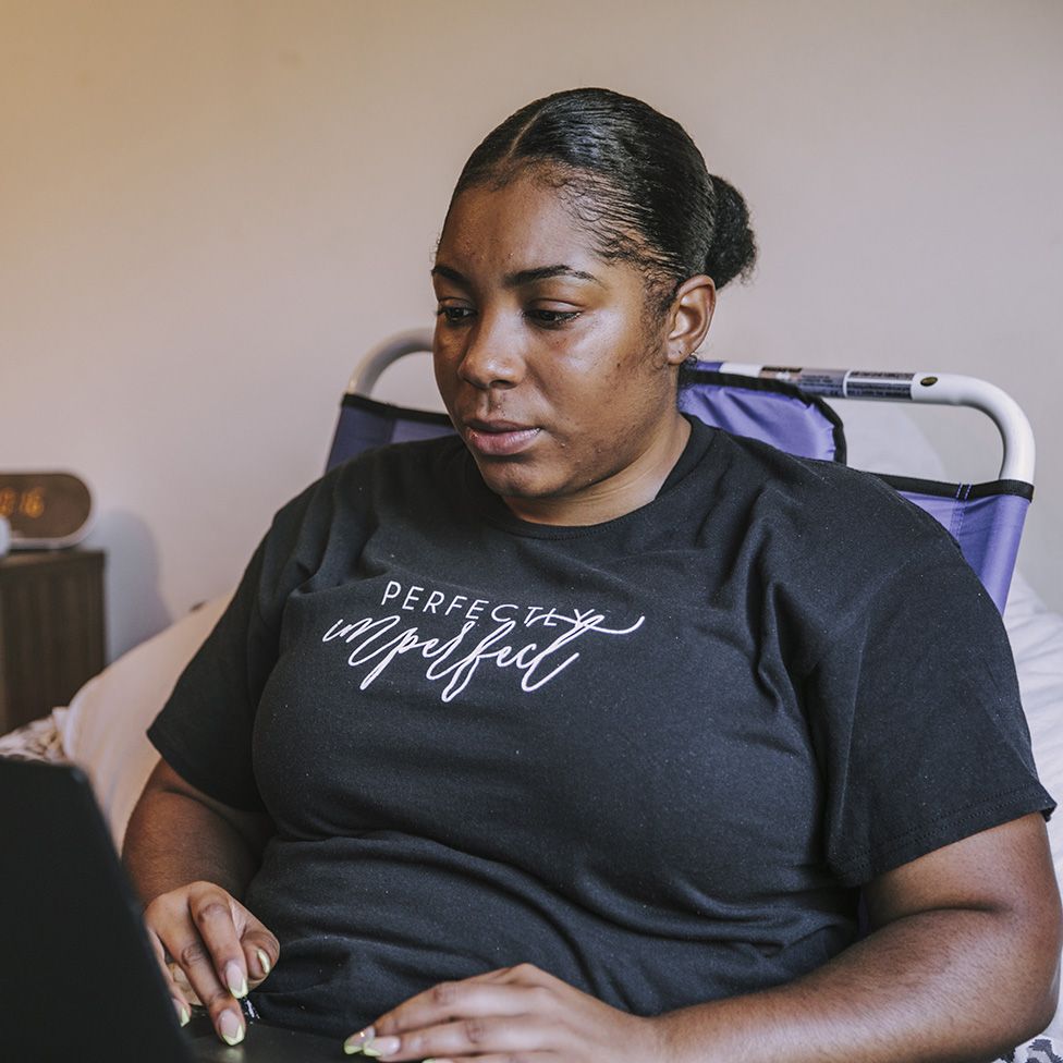 Jade Gray-Christie at work on her laptop