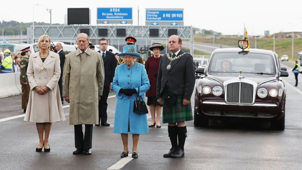 Queen Elizabeth II (C) and Prince Philip, Duke of Edinburgh (2L) stand during the official opening ceremony for the Queensferry Crossing, a new road bridge spanning the Firth of Forth from Queensferry to North Queensferry, in Queensferry, west of Edinburgh, on September 4, 2017