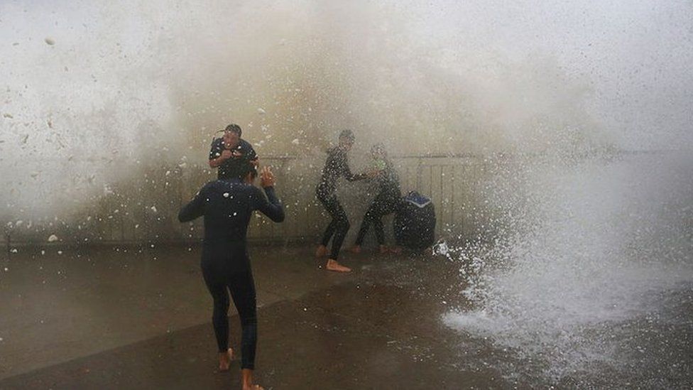 Children are soaked by huge waves at Bronte Beach