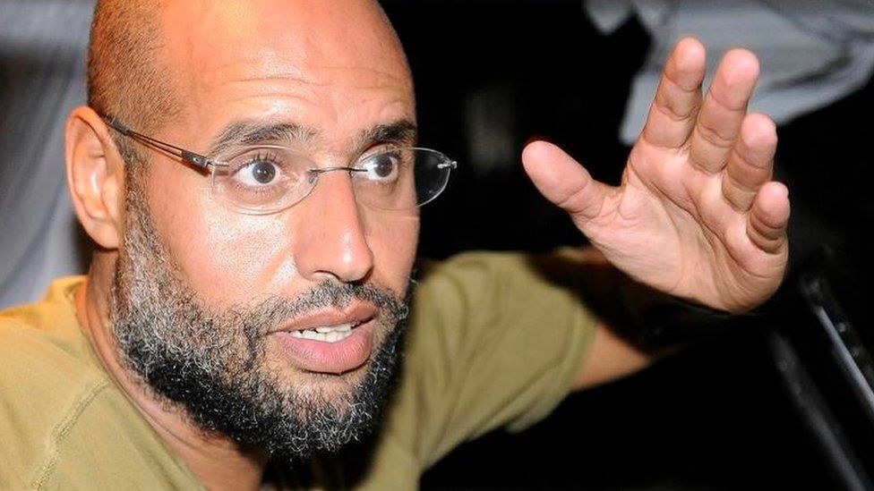 Saif Al-Islam, son of Libyan leader Muammar Gaddafi, gestures as he talks to reporters in Tripoli August 23, 2011