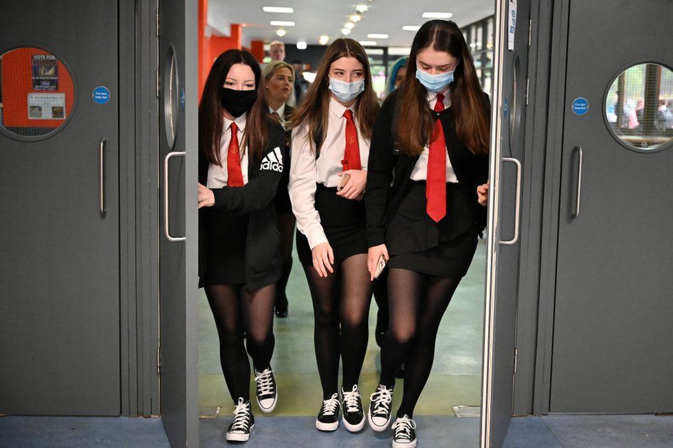 Anyone who wishes to wear a face covering in school or on school transport is allowed - but they are not compulsory