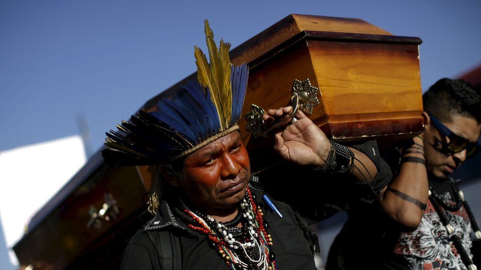 Indigenous leaders protest with a coffin against the murder of the leader of the Guarani Kaiowa ethnicity, Semiao Vilhalva, in Brasilia, Brazil 01 September 2015.