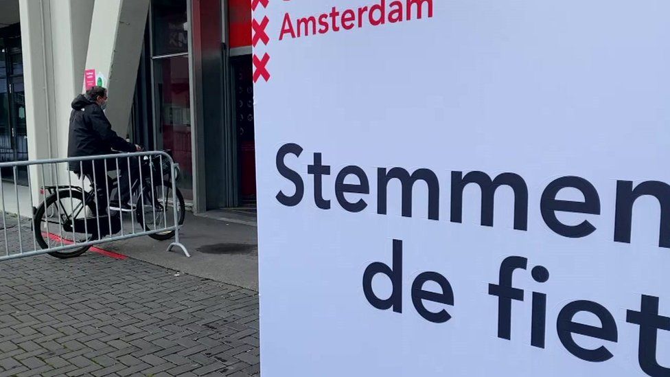 Voting in a time of Covid: This Amsterdam polling station enables cyclists to cast their vote on the go