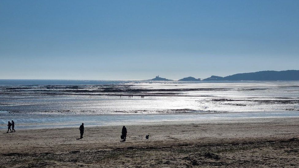 There were a few people enjoying the sunshine on the beach in Swansea on Sunday