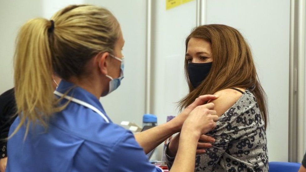 Woman being vaccinated in Reading