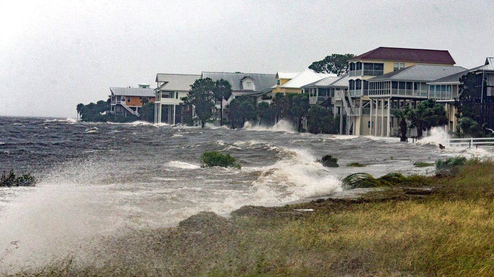 The storm surge and waves from Hurricane Michael batter the beachfront homes on October 10, 2018 in Florida