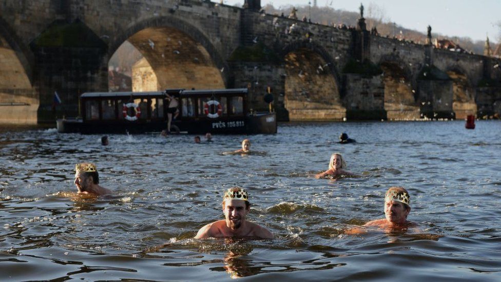 men-swimming-in-the-Vltava-river-in-Prague.