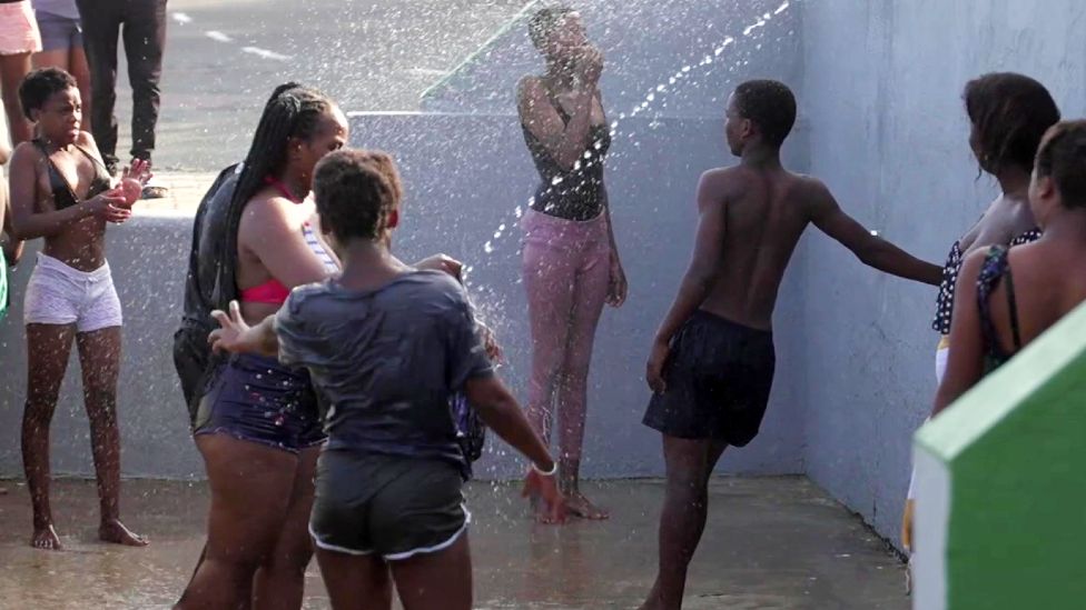 People showering at Ballito beach in KwaZulu-Natal in South Africa - December 2021