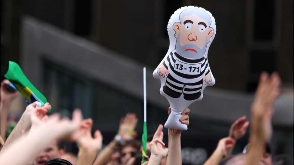 A demonstrator holds an inflatable doll known as "Pixuleco" of Brazil"s former President Luiz Inacio Lula da Silva during a protest against Brazil"s President Dilma Rousseff appointment of Lula da Silva as her chief of staff at Paulista avenue in Sao Paulo, Brazil, March 17, 201