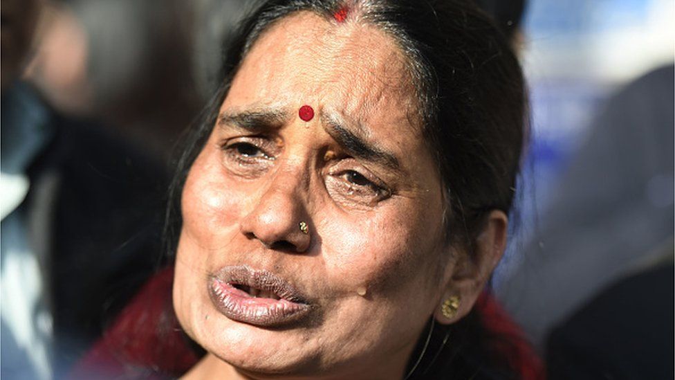 Asha Devi speaks to media outside Patiala House Court, on February 12, 2020 in Delhi. The court sought response of the four death-row convicts on a plea by the victims parents and the Delhi government seeking issuance of fresh death warrant