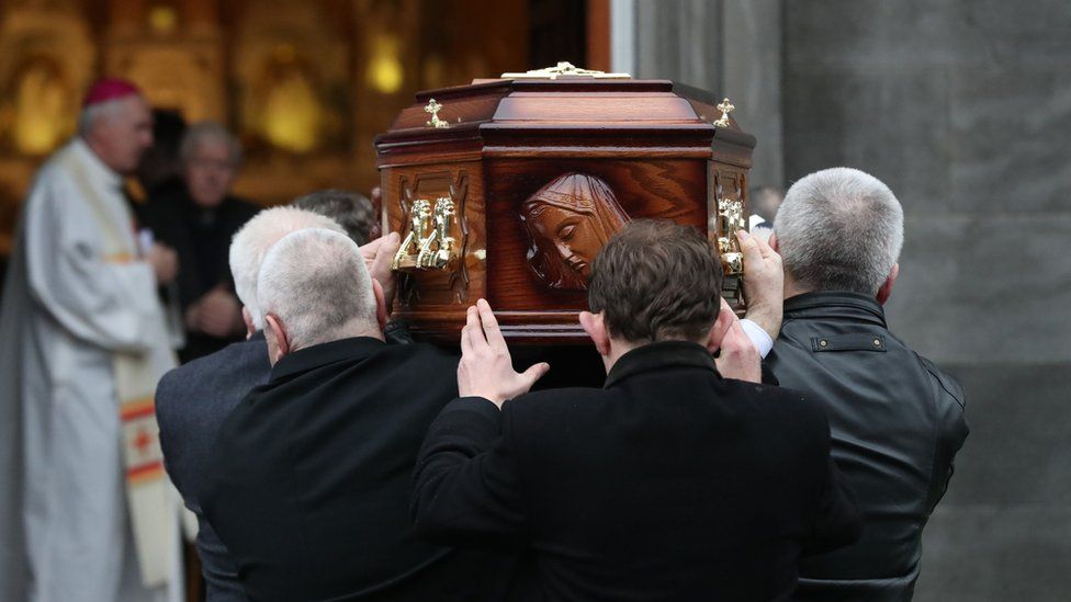 Dolores O'Riordan's coffin is carried into the church by pallbearers
