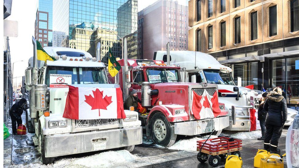 Truckers refuel their trucks in the cold during the Freedom Convoy truck protest on February 5, 2022 in Ottawa, Canada.