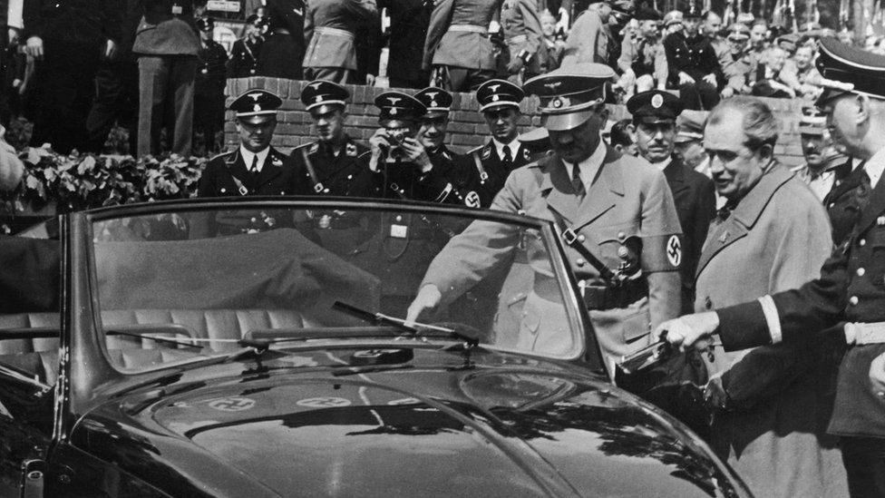 Nazi leader Adolf Hitler (1889 - 1945) inspects the new, Volkswagen "people's car" at the Fallersleben car factory, 27 May 1938