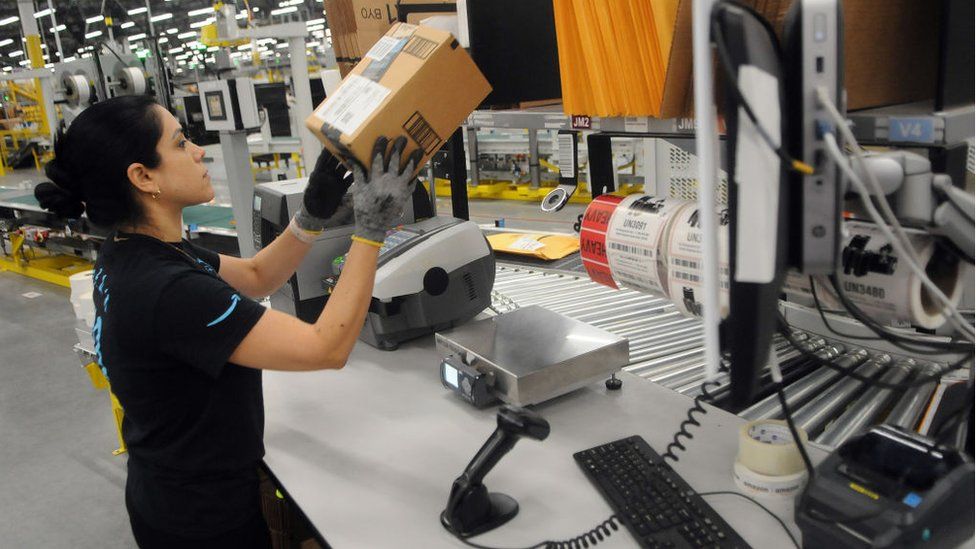 Worker in an Amazon fulfilment centre