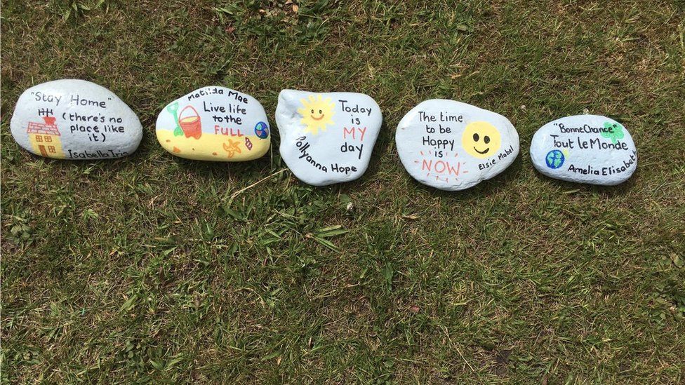 Pebbles painted with positive messages