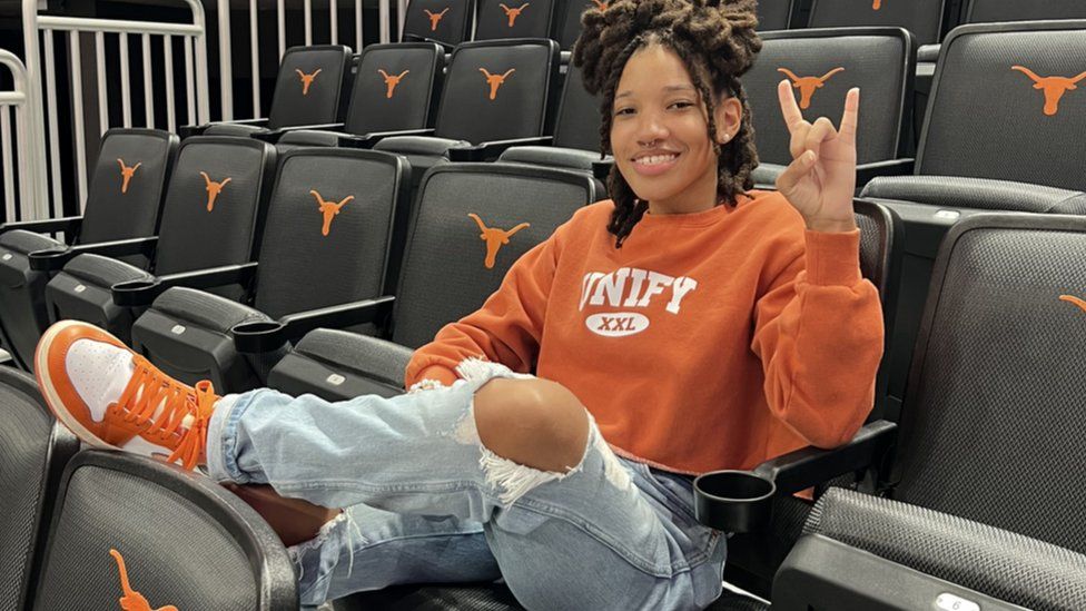 Madison Morris sits inside the basketball arena at the University of Texas