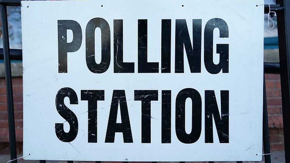 A stock image of a polling station sign