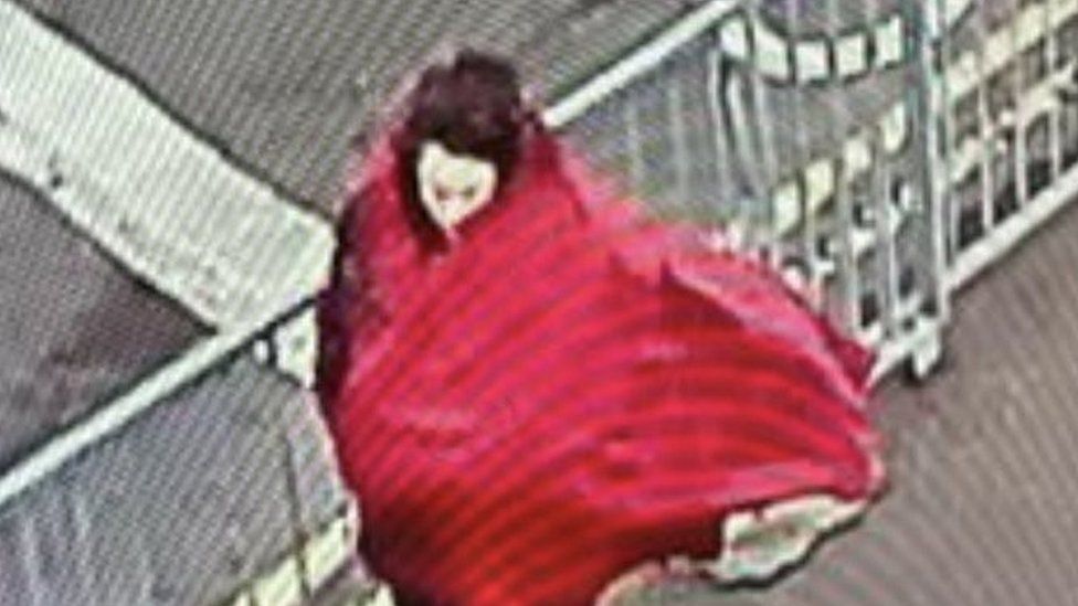 CCTV of woman with red scarf