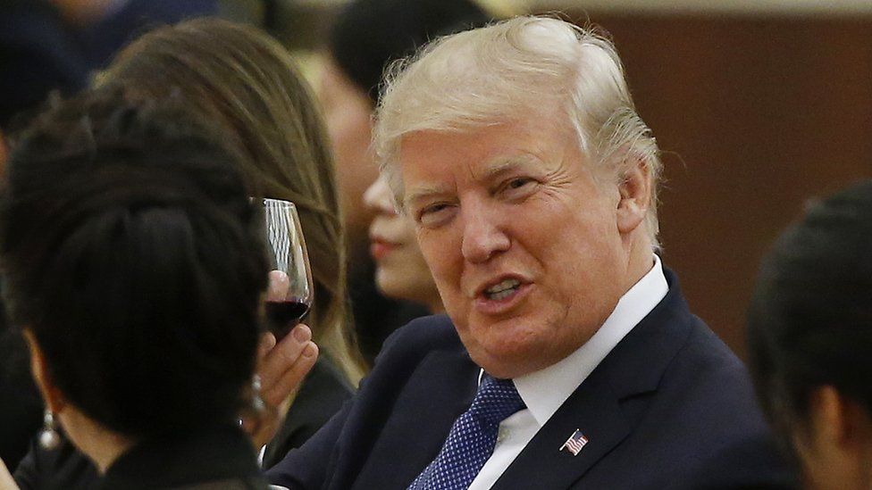President Trump with glass of wine