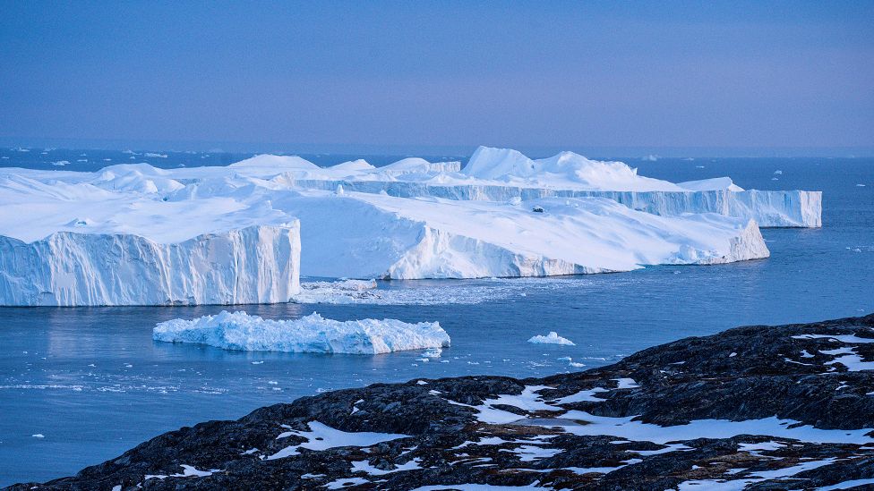 Icebergs, calved from the Sermeq Kujalleq glacier, float in the Ilulissat Icefjord.