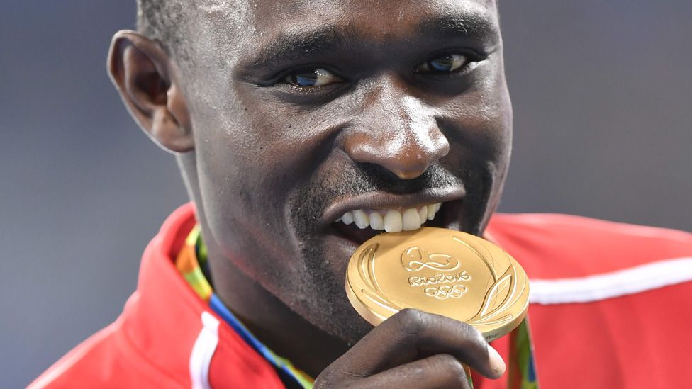 Gold medallist Kenya's David Lekuta Rudisha celebrates on the podium for the Men's 800 meter during the athletics at the Rio 2016 Olympic Games at the Olympic Stadium in Rio de Janeiro on 16 August 2016.