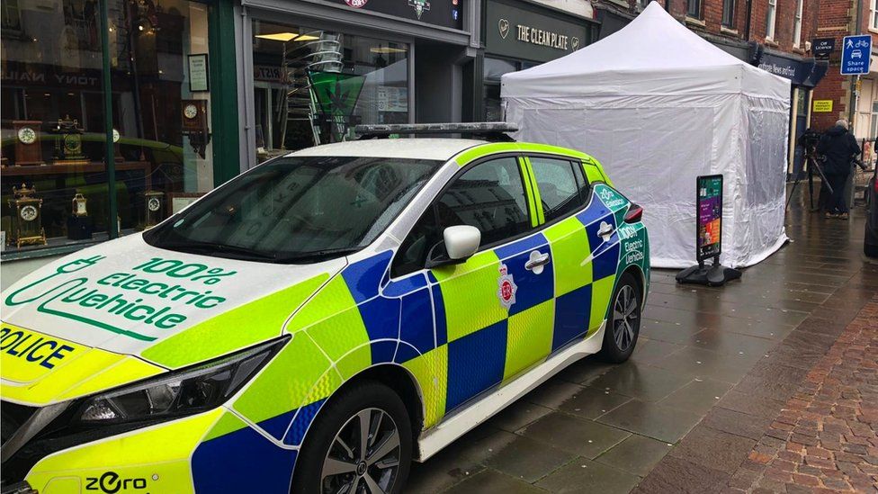 Police car outside Clean Plate Cafe in Gloucester