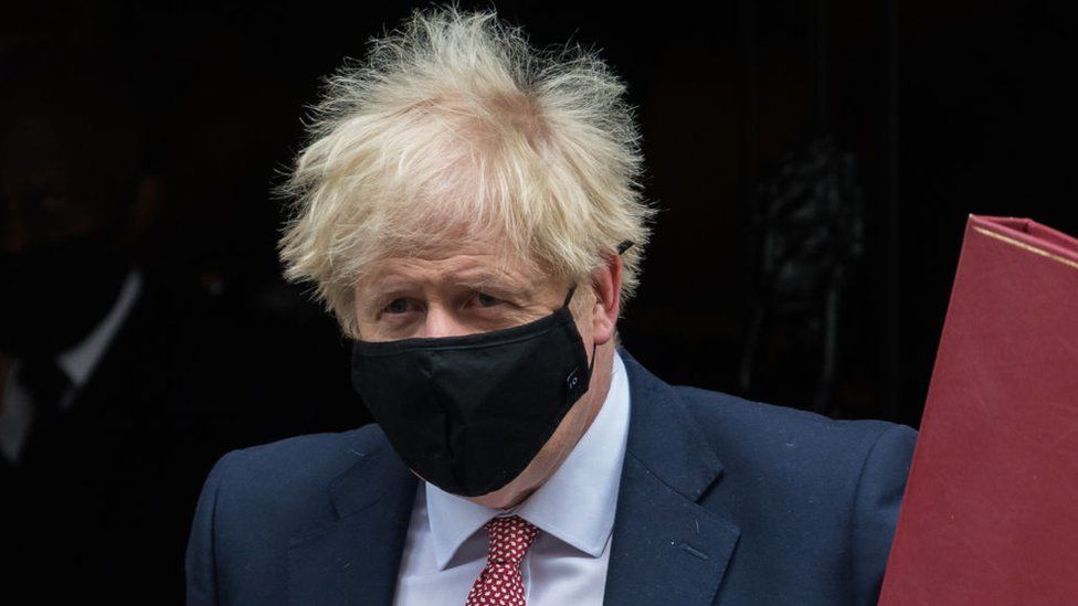 UK Prime Minister Boris Johnson wearing a mask