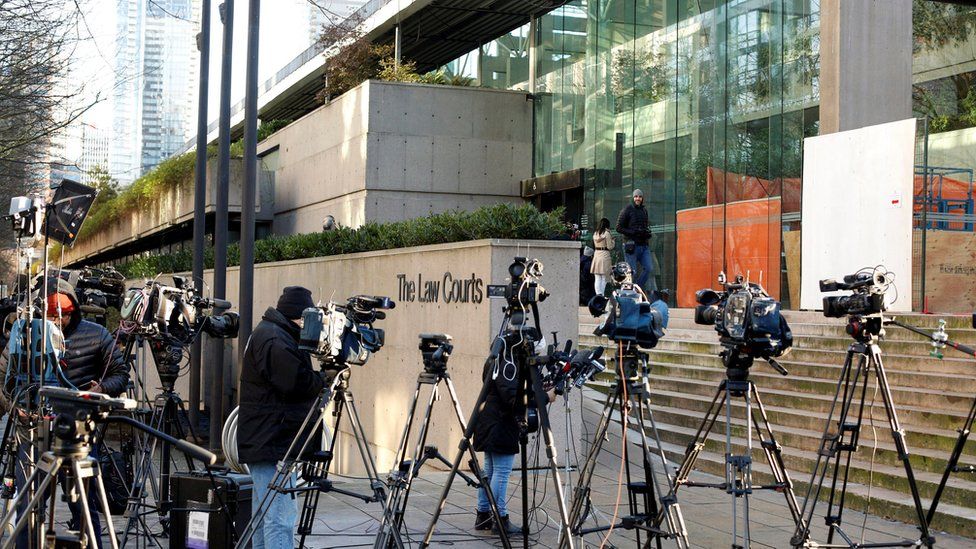 Members of the news media stand outside the BC Supreme Court bail hearing of Huawei CFO Meng Wanzhou, who was held on an extradition warrant in Vancouver, British Columbia, Canada December 7, 2018