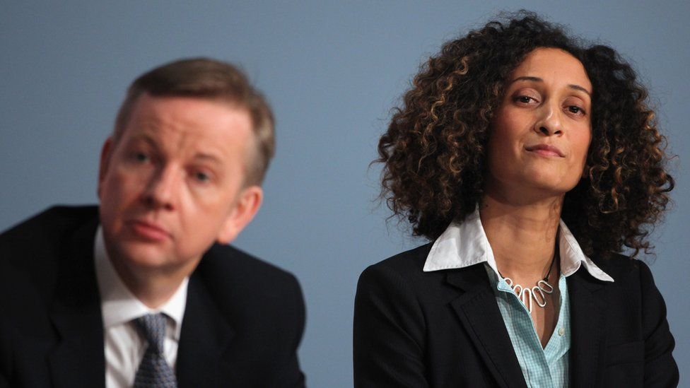 Katharine Birbalsingh seated to the right of Michael Gove at an event