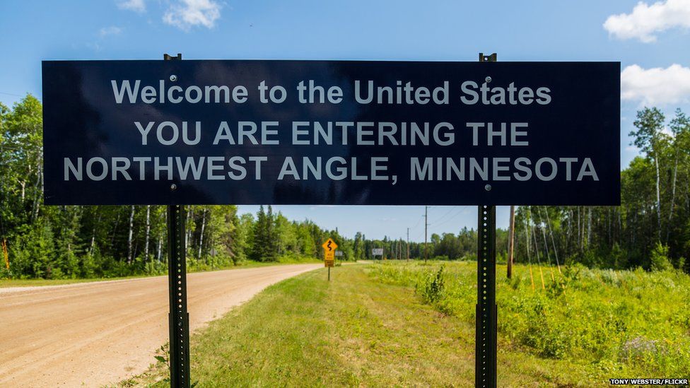 A sign marks the entrance to the Northwest Angle of Minnesota, from rural Manitoba, Canada.