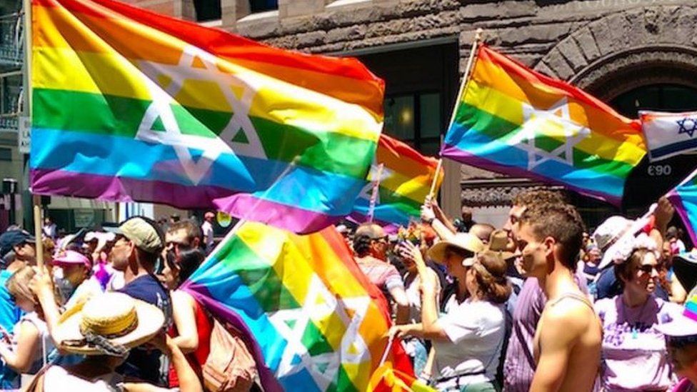 Rainbow flags with stars of david