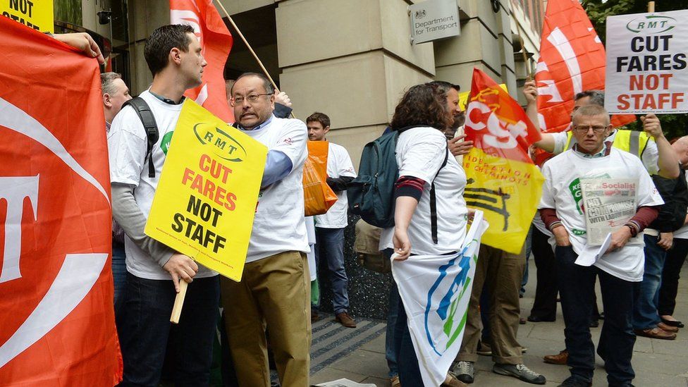 Members of the RMT union demonstrate outside the Department for Transport