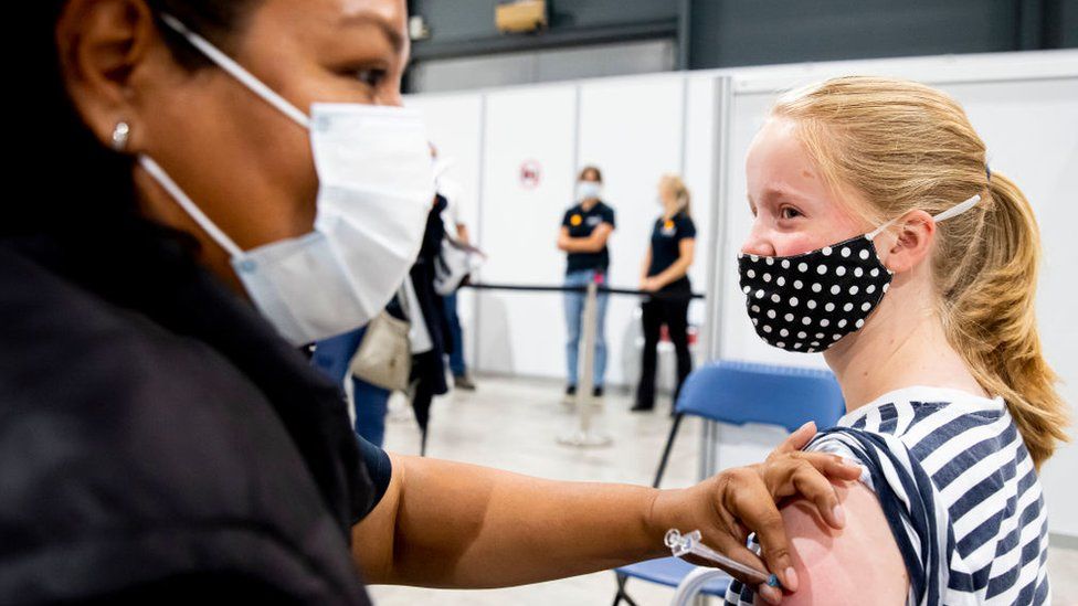 Girl receiving Covid vaccination in the Netherlands in July 2021