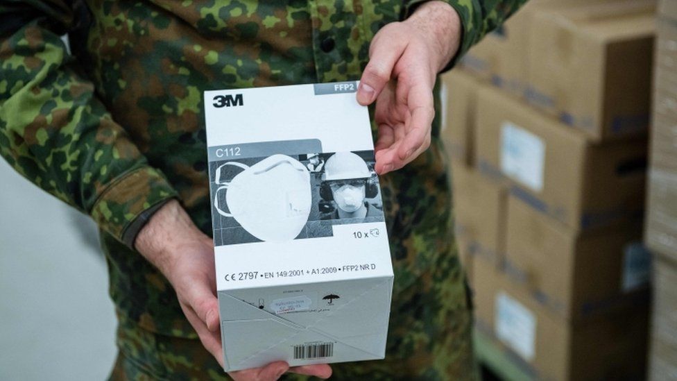 A German soldier unpacks boxes of FFP2 quality masks on 1 April, 2020