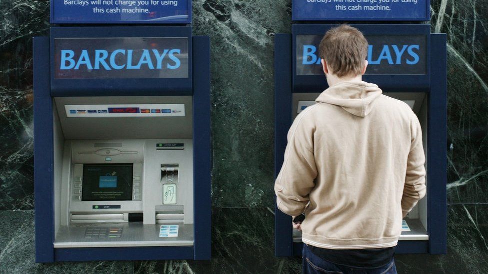Man using Barclays ATM machine