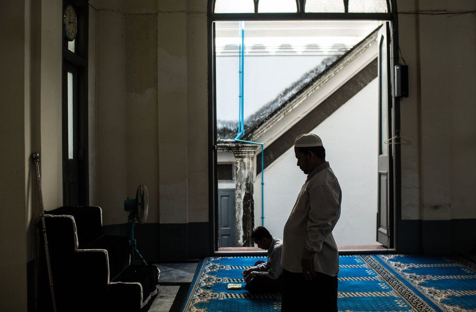 Farooq leads the Zuhr - midday - prayer at the Shia Mughal Mosque in downtown Yangon, Myanmar, November 19, 2015
