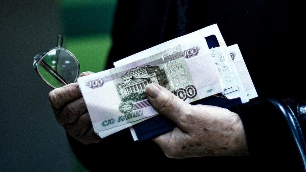 Man carrying Russian roubles - file pic