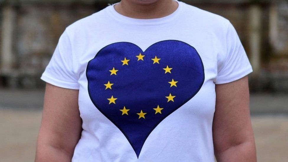 A non-British EU citizen, unable to vote in the EU referendum, poses wearing an EU-flag themed t-shirt