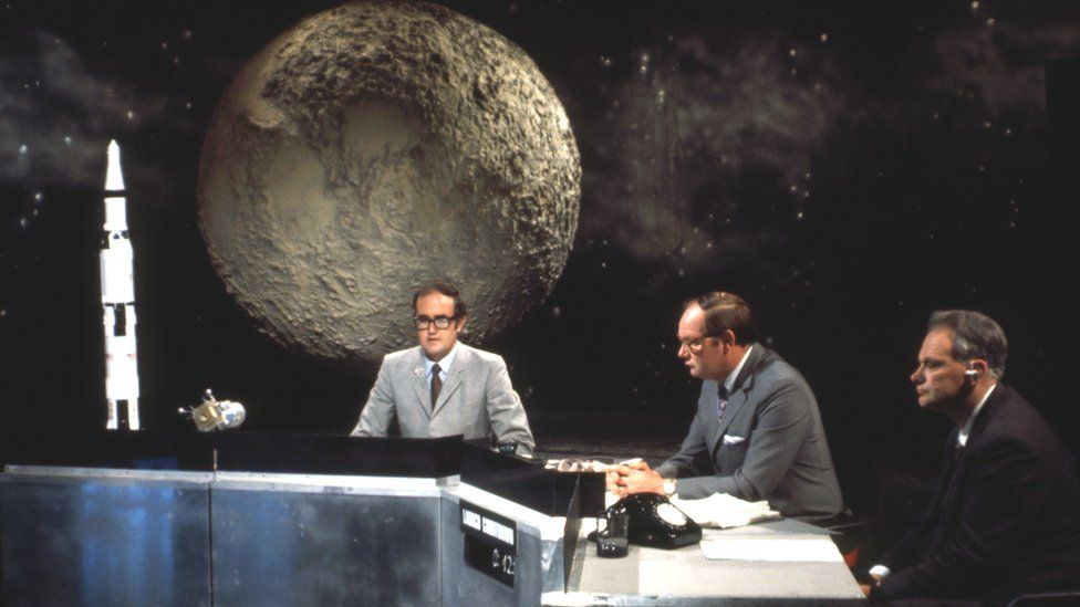 Michelmore (centre) presented coverage of the Apollo 11 mission to the moon in 1969, alongside James Burke (left), and Patrick Moore (right)