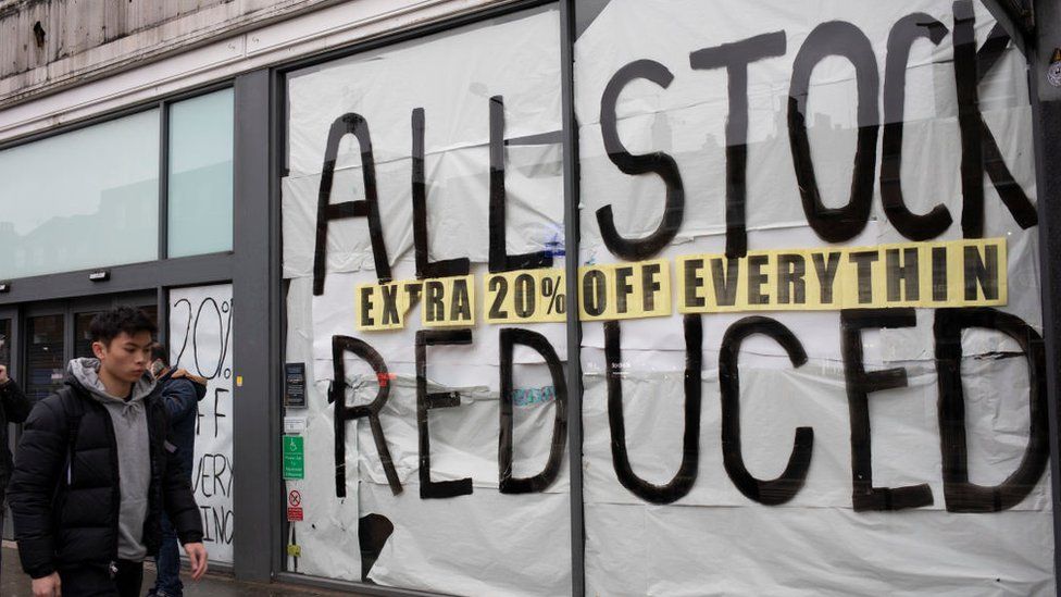 Shop with all stock reduced sign