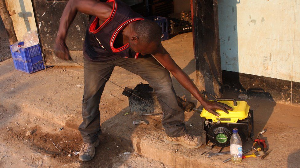 Man starting a with generator